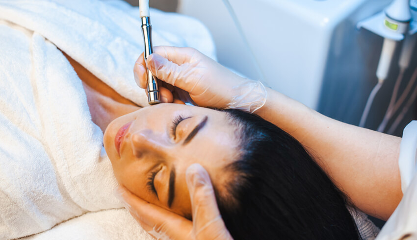  a woman undergoing a microdermabrasion